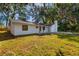 Charming home with freshly painted white brick and mature landscaping at 2517 Royal Palm Dr, Edgewater, FL 32141