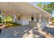 Covered patio with concrete flooring and white support posts at 2517 Royal Palm Dr, Edgewater, FL 32141