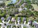 Aerial view of the community with pond and golf course at 25962 High Hampton Cir, Sorrento, FL 32776
