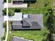 Aerial view of the home, showing the roof and lush lawn at 25962 High Hampton Cir, Sorrento, FL 32776