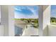 Balcony view showcasing the neighborhood with lush greenery and clear blue skies at 25962 High Hampton Cir, Sorrento, FL 32776