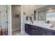 Main bathroom with dual sinks, marble countertops, and modern fixtures at 25962 High Hampton Cir, Sorrento, FL 32776