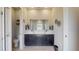 Main bathroom with double sinks, a large mirror, and modern vanity at 25962 High Hampton Cir, Sorrento, FL 32776