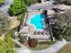 Aerial view of community pool with outdoor seating and landscaping at 25962 High Hampton Cir, Sorrento, FL 32776