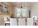Dining room with modern lighting, table with seating, and elegant decor at 25962 High Hampton Cir, Sorrento, FL 32776