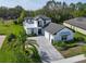 Beautiful two-story home with a stone paver driveway and manicured landscaping at 25962 High Hampton Cir, Sorrento, FL 32776