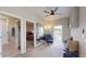 Inviting living room with a comfortable seating area and large mirror that reflects the spacious interior at 25962 High Hampton Cir, Sorrento, FL 32776