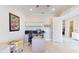 Bright home office with ceiling fan, modern desk setup, white cabinets, and wood-look flooring at 25962 High Hampton Cir, Sorrento, FL 32776