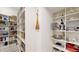 Walk-in pantry with white shelving for organized storage at 25962 High Hampton Cir, Sorrento, FL 32776