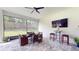 Outdoor covered patio with dining and bar areas, perfect for entertaining with views of the backyard at 25962 High Hampton Cir, Sorrento, FL 32776