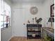 Foyer featuring a decorative table with ornate lamps, a decorative rooster, and a clock adorning the wall at 26032 Newcombe Cir, Leesburg, FL 34748