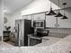 Modern kitchen featuring stainless steel appliances, granite countertops, sleek cabinetry, and stylish pendant lighting at 26032 Newcombe Cir, Leesburg, FL 34748