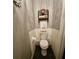 Cozy half-bath features a neutral color scheme, updated fixtures and white tiled walls up to the gray painted wall at 2756 Sequoyah Dr, Haines City, FL 33844