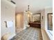Bathroom with large vanity, decorative mirror and chandelier, and tile flooring at 2756 Sequoyah Dr, Haines City, FL 33844