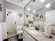 Renovated bathroom with updated fixtures, granite vanity, and a glass enclosed shower at 2756 Sequoyah Dr, Haines City, FL 33844