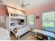 Charming pink bedroom featuring a built-in bunk bed and natural light at 2756 Sequoyah Dr, Haines City, FL 33844