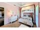 Cozy pink bedroom featuring a built-in bunk bed, white furniture and natural light at 2756 Sequoyah Dr, Haines City, FL 33844
