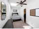 Cozy bedroom featuring natural light with ceiling fan and ample closet space at 2756 Sequoyah Dr, Haines City, FL 33844