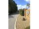 Entrance to Sequoyah Ridge community featuring a brick sign, gated entry, and well-maintained landscaping at 2756 Sequoyah Dr, Haines City, FL 33844