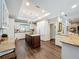 Spacious kitchen with white cabinetry, granite countertops, stainless steel appliances, and a central island at 2756 Sequoyah Dr, Haines City, FL 33844