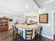 Open kitchen with granite countertops, an island with seating, and views into other living spaces at 2756 Sequoyah Dr, Haines City, FL 33844