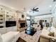 Inviting living room with a brick fireplace, built-in shelving, and an open layout at 2756 Sequoyah Dr, Haines City, FL 33844