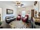 Comfortable seating area with two red leather recliners and animal print rug at 2756 Sequoyah Dr, Haines City, FL 33844