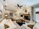 Cozy living room features a brick fireplace, built-in shelving, and comfortable seating at 2756 Sequoyah Dr, Haines City, FL 33844