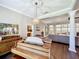 Bright living room featuring hardwood floors, ornate ceilings, and a grand piano at 2756 Sequoyah Dr, Haines City, FL 33844