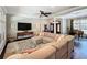 Expansive living room features a plush sectional sofa, patterned rug, and stylish furnishings at 2756 Sequoyah Dr, Haines City, FL 33844