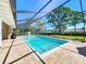 Inviting screened-in pool with clear blue water and a spacious deck area, perfect for relaxation at 2756 Sequoyah Dr, Haines City, FL 33844