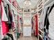 Organized walk-in closet featuring ample storage, shelving, and a stylish light fixture at 2756 Sequoyah Dr, Haines City, FL 33844