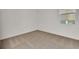 Neutral bedroom featuring neutral carpeting, white walls, and a window at 2980 Supermarine Rd, Tavares, FL 32778