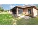 Charming home exterior with a screened porch, set amidst a lush green lawn and well-maintained landscaping at 3048 New Haven Pl, Mount Dora, FL 32757