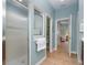 Bathroom featuring a glass-enclosed shower with a towel rack and tile flooring at 3048 New Haven Pl, Mount Dora, FL 32757