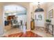 Inviting foyer offers views into the dining area and kitchen, featuring tile and hardwood flooring at 3048 New Haven Pl, Mount Dora, FL 32757
