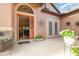 Welcoming home entrance boasts a decorative glass door, complemented by potted flowers and French doors at 3048 New Haven Pl, Mount Dora, FL 32757