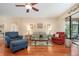 Inviting living room with plush seating and sliding glass doors to the lanai at 3048 New Haven Pl, Mount Dora, FL 32757