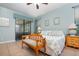 Airy main bedroom offering access to the lanai, ceiling fan, and neutral decor at 3048 New Haven Pl, Mount Dora, FL 32757