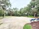 Outdoor basketball court with benches in community at 3275 Oak Brook Ln, Eustis, FL 32736
