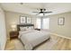 Bedroom with ceiling fan, hardwood floors, and closet at 3275 Oak Brook Ln, Eustis, FL 32736