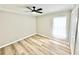 Minimalist bedroom with a window and ceiling fan for added comfort at 3275 Oak Brook Ln, Eustis, FL 32736