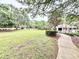Large green space with walking path and covered pavilion at 3275 Oak Brook Ln, Eustis, FL 32736