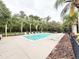 Community swimming pool with plenty of lounge chairs for residents to enjoy while relaxing at 3275 Oak Brook Ln, Eustis, FL 32736