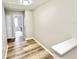 Upstairs hallway with wood flooring leads to bedrooms and bathrooms in the home at 3275 Oak Brook Ln, Eustis, FL 32736