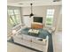 Bright living room showcasing ample natural light, ceiling fan, and cozy seating arrangement at 3275 Oak Brook Ln, Eustis, FL 32736