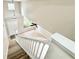 Upper level view of living room with staircase and tile flooring at 3275 Oak Brook Ln, Eustis, FL 32736