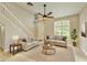 Staged living room with high ceilings and large windows at 3275 Oak Brook Ln, Eustis, FL 32736