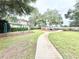 Community playground with swings and climbing structures at 3275 Oak Brook Ln, Eustis, FL 32736