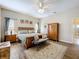 A spacious primary bedroom offers a relaxing retreat with natural light and ample space, ideal for comfort at 3551 Mulberry Grove Loop, Leesburg, FL 34748